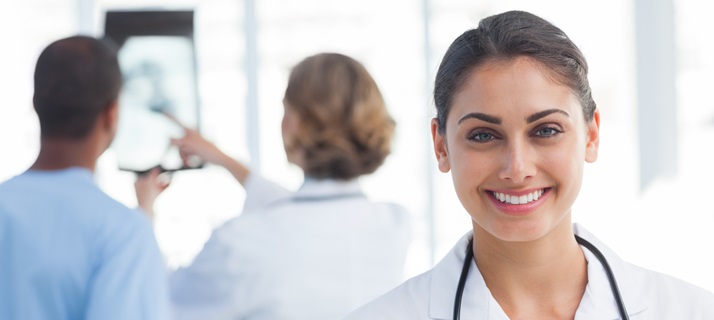 20s, Young Adult, Woman, Female, Caucasian, Man, Male, Mixed-Race, 40s, Mature Adult, Indoors, Looking At Camera, Nurse, Tunic, Practitioner, Profession, Professional, Specialist, Scrubs, Stethoscope, Standing, Clinic, Healthcare, Medical, Staff, Smiling, Happy, Cheerful, Portrait, Team, Talking, Holding, X-ray, Pointing, Hospital